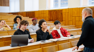 Education marketing: Students facing lecturer in lecture theatre